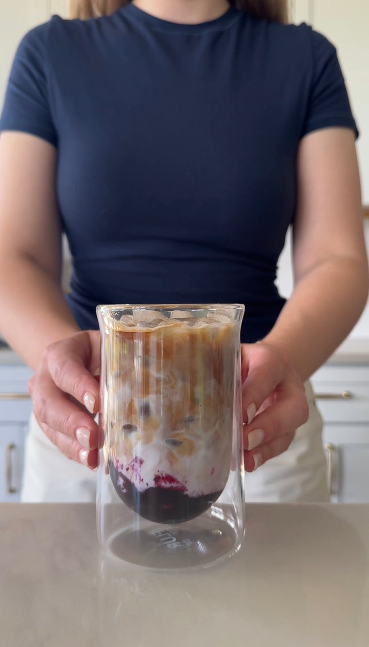 Layered iced latte held in a double-wall glass